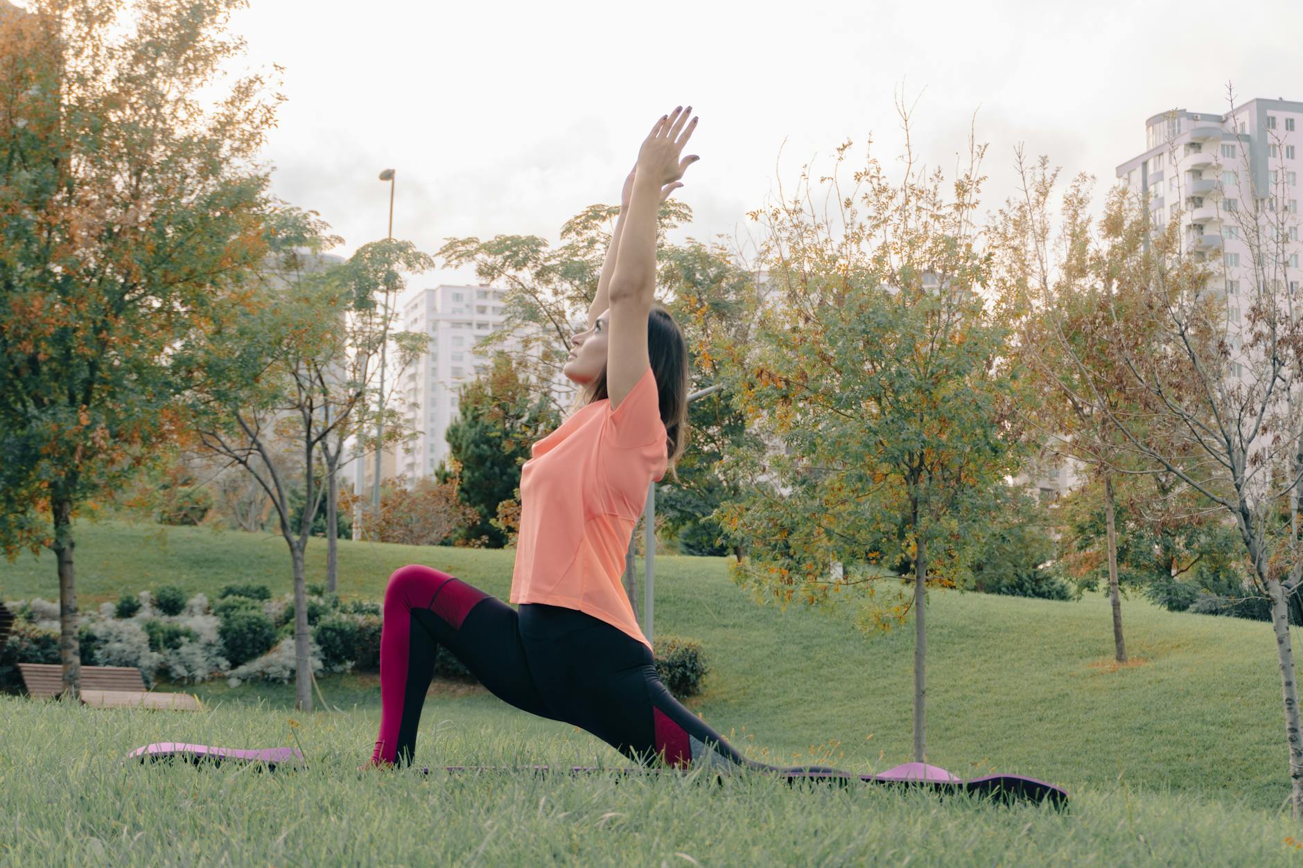 Woman in a calm yoga pose, embodying fluid movement and stability.